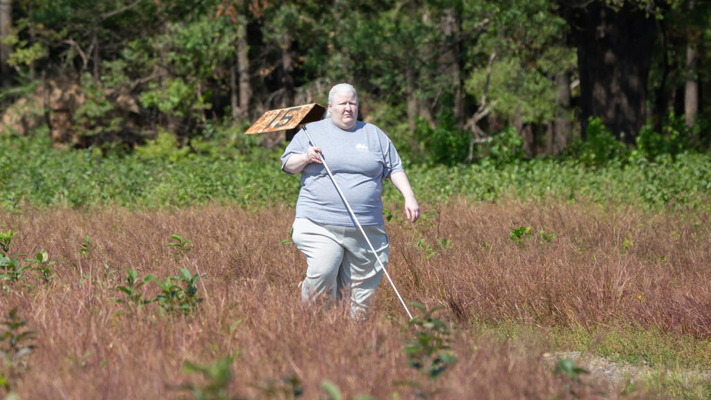 Ginny walking through a meadow